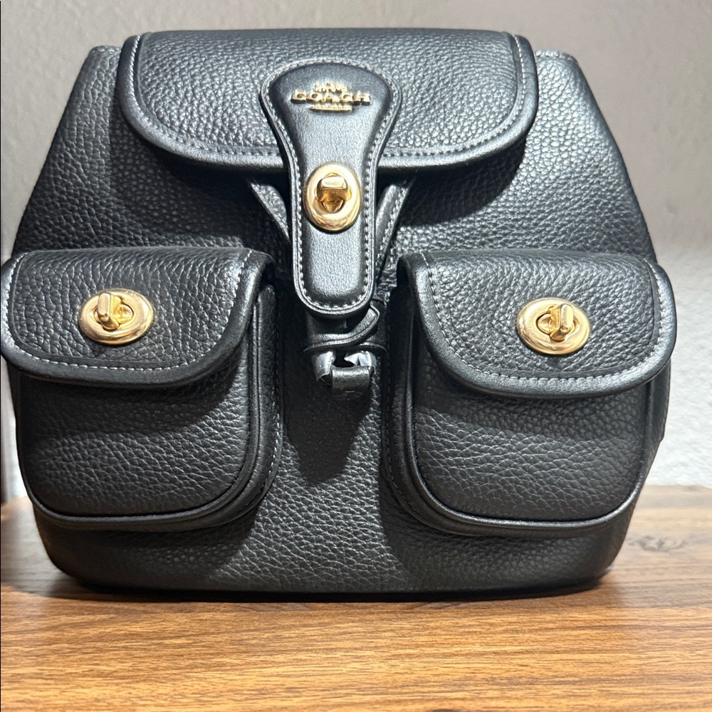 Coach Black Pebbled Leather Backpack with Gold Hardware and Front Pockets